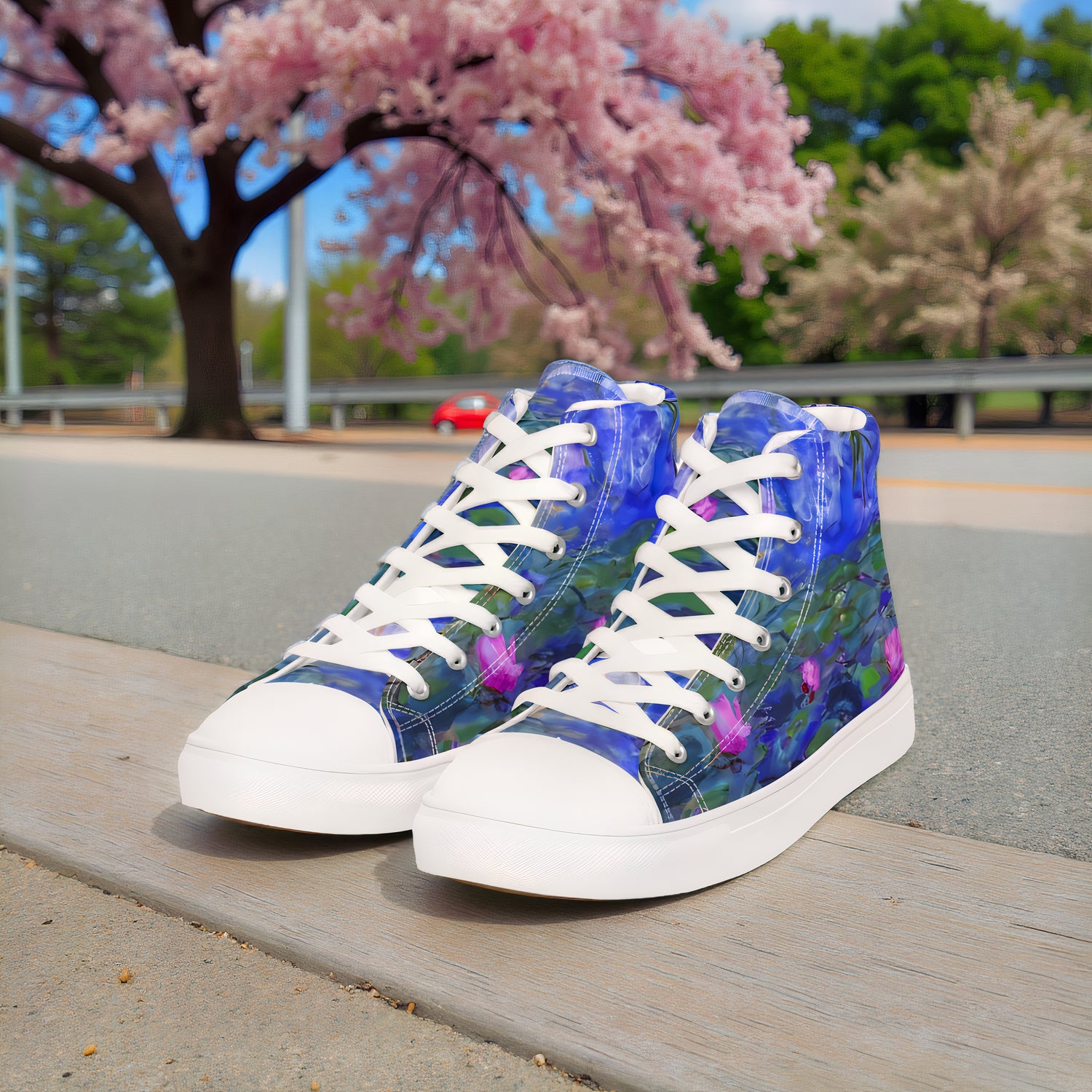 Monet Water Lilies high-top sneakers on a street with trees across the road.
